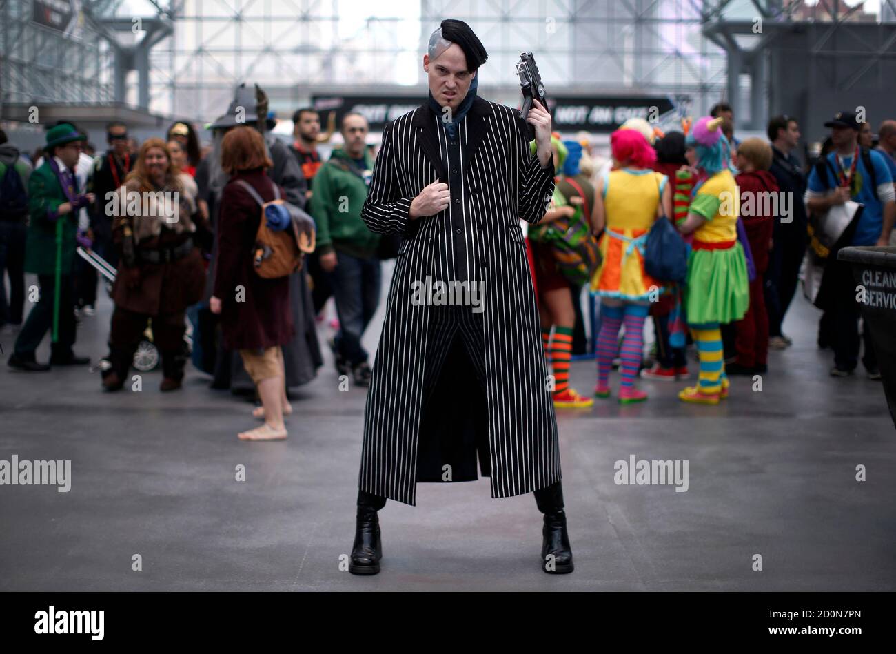 Chris Vick from Los Angeles, California, dressed as Jean Baptiste Emanuel  Zorg from the film "The Fifth Element" poses for a photograph at New York's  Comic-Con convention October 11, 2013. The event
