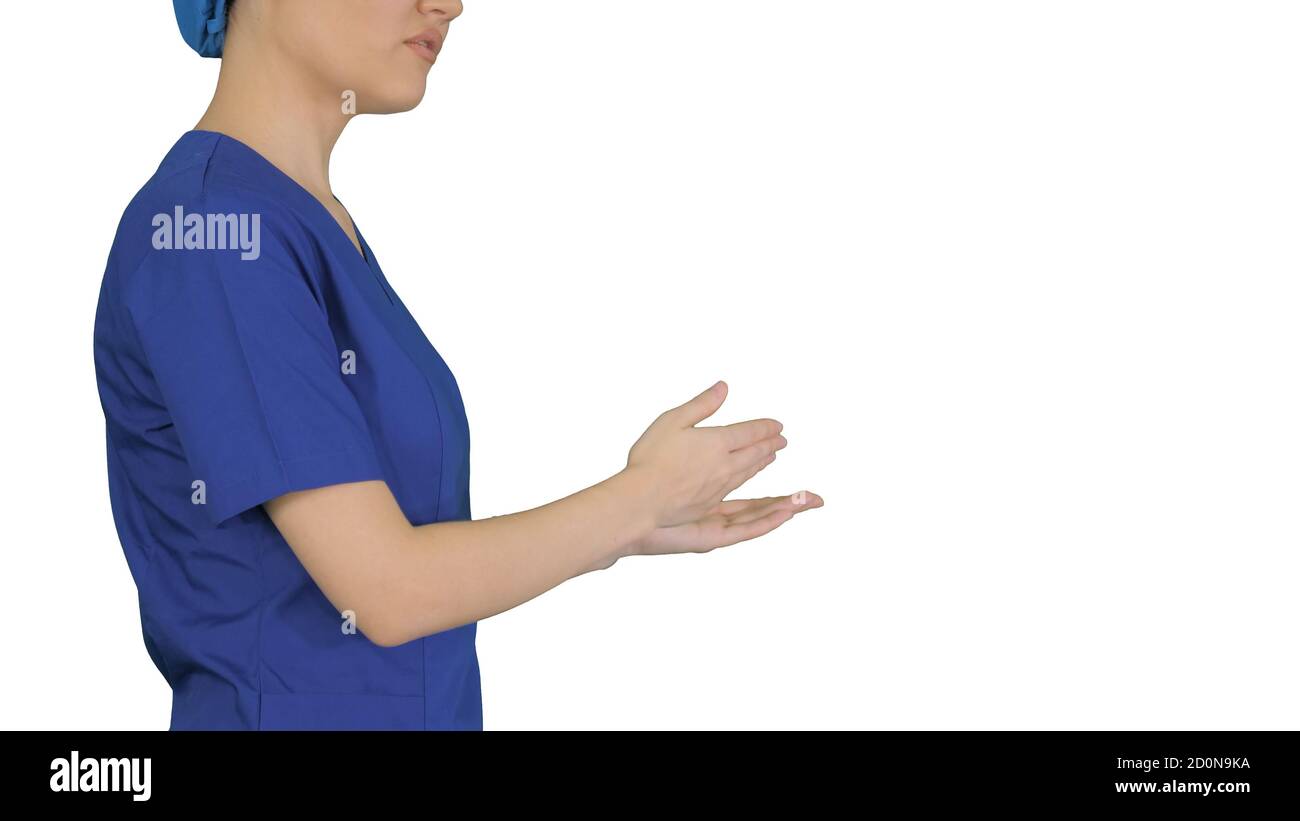 Female doctor in blue uniform talking about medical care on whit Stock Photo