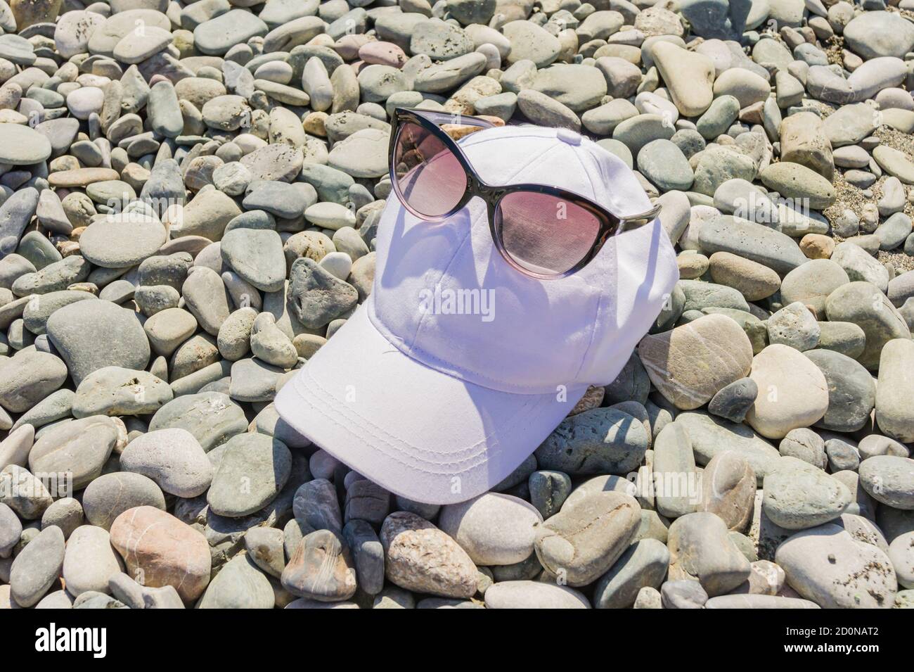Woman in sunglasses cap hi-res stock photography and images - Alamy