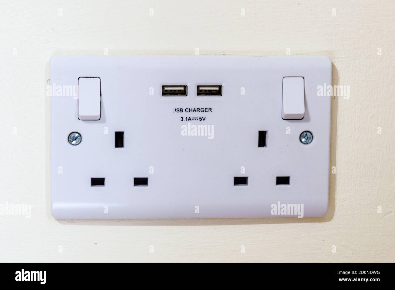 UK gang plug socket with USB outlets Stock Photo