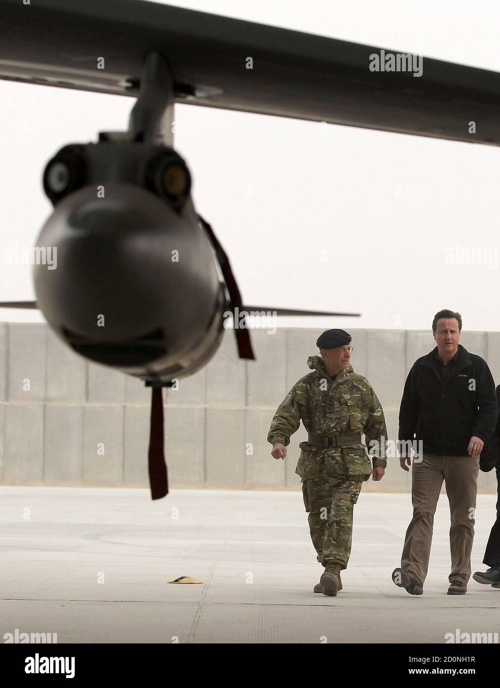 Britain's Prime Minister David Cameron views a Tornado fighter jet based with 12 (B) squadron at Kandahar airfield during a visit to meet British forces in Afghanistan December 20, 2011. REUTERS/Jeff J Mitchell/Pool (AFGHANISTAN - Tags: MILITARY POLITICS CONFLICT) Stock Photo