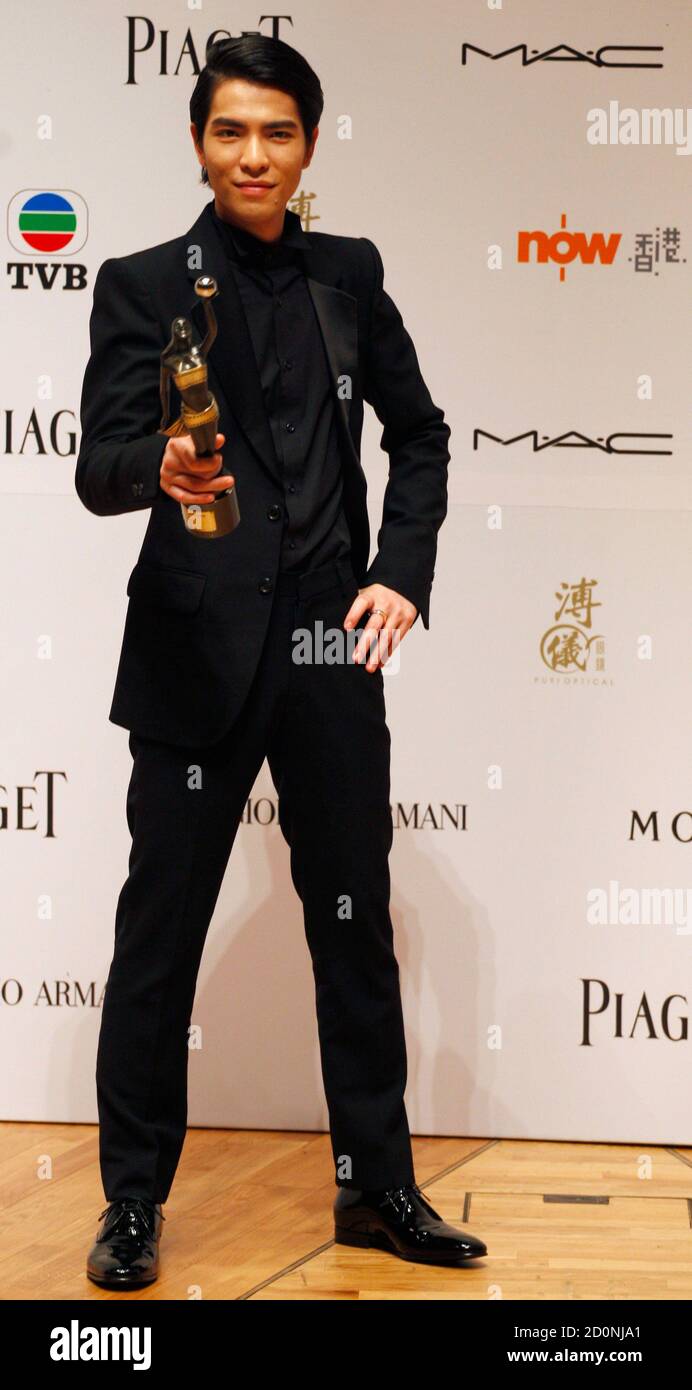 Taiwan singeractor Jam Hsiao poses with his trophy after winning the Best New Performer award