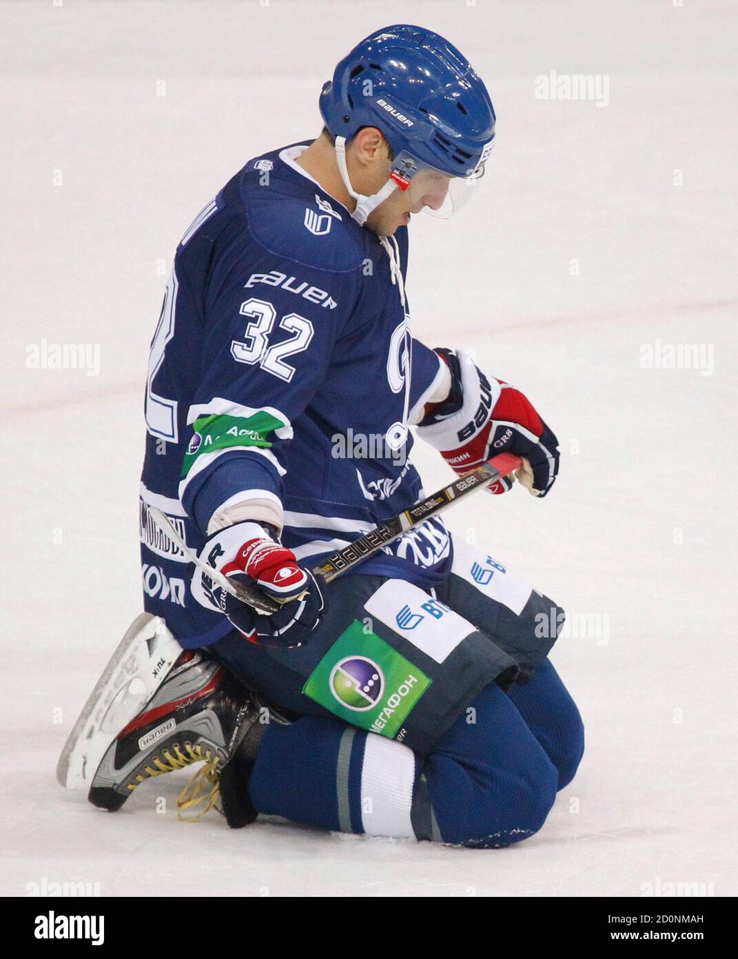 Dynamo Moscow's Alexander Ovechkin kneels down on the ice during their  Kontinental Hockey League (KHL) game against SKA St. Petersburg in Moscow  September 23, 2012. Alexander Ovechkin has become the latest high-profile