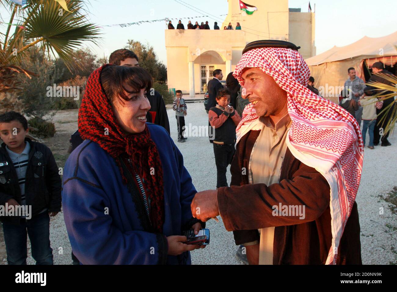 Myasar Sardeyeh (R), from Jordanian Bedouin tribes north, speaks with her  supporters at her electoral headquarters in Al Mafraq city near Amman  January 19, 2013. Jordanian Islamists, who will boycott next week's