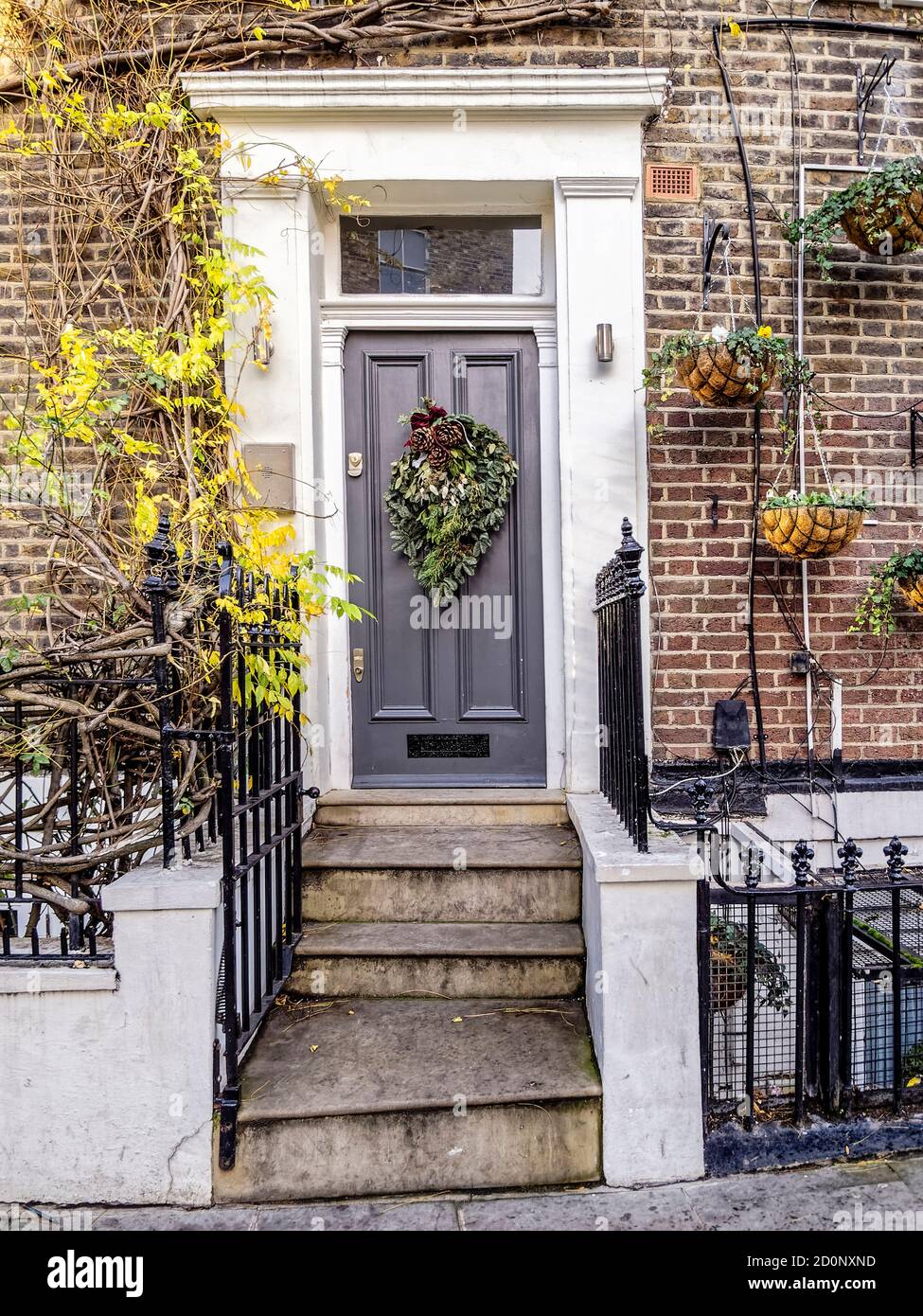 British Christmas. A classic Notting Hill house door with festive decorations in London, United Kingdom. Stock Photo