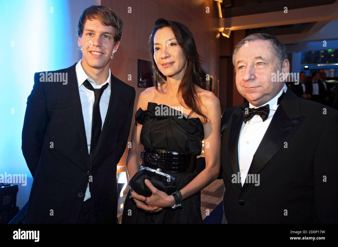 2010 Formula One World Champion Sebastien Vettel L Of Germany Poses With Fia President Jean Todt R And His Wife Movie Actress Michelle Yeoh During The 2010 Fia Prize Giving Gala In