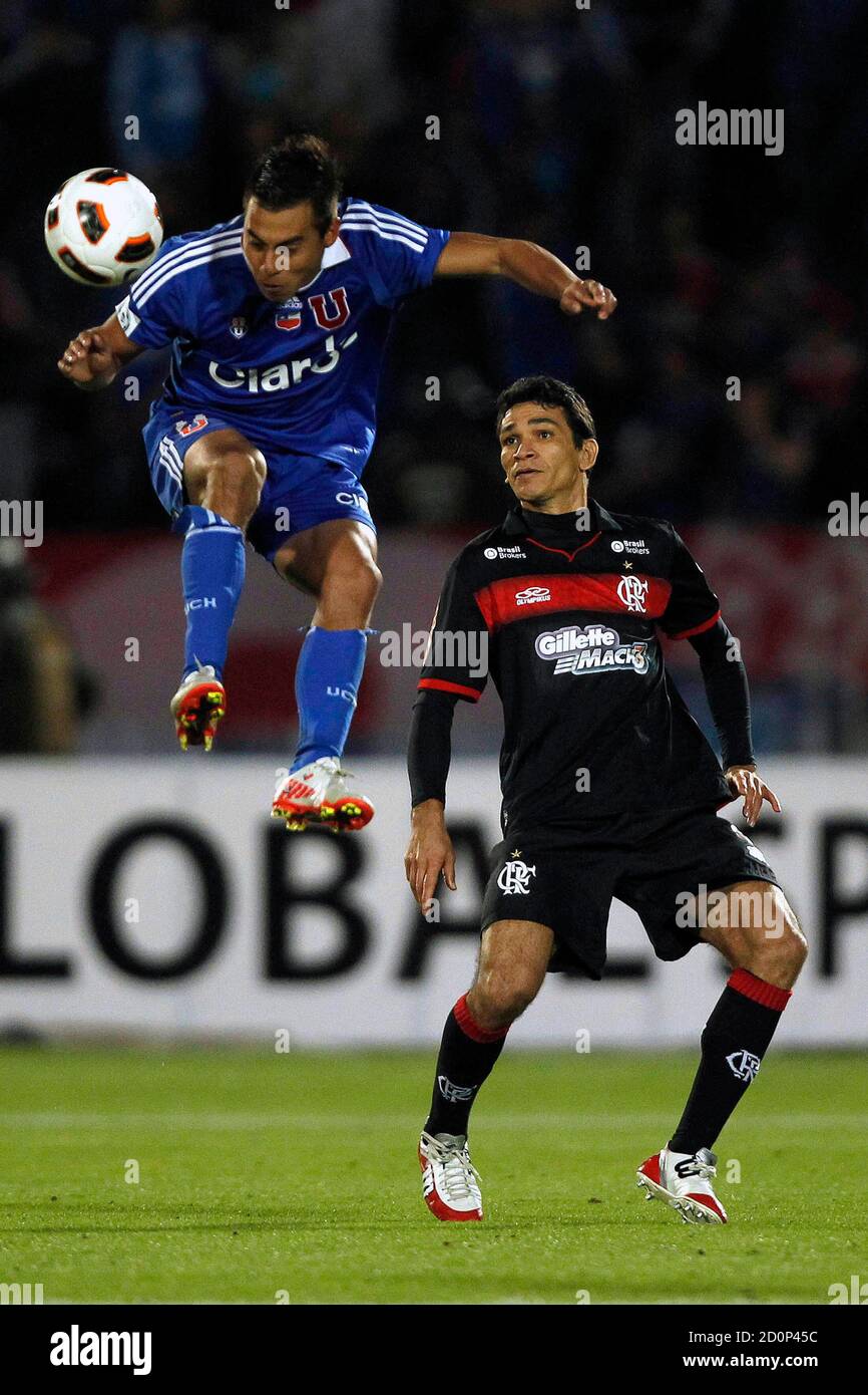 Eduardo Vargas Top From Chile S Universidad De Chile Jumps For The Ball As Robaldo Angelim From Brazil S Flamengo Looks On During Their Copa Sudamericana Soccer Match In Santiago October 26 2011 Reuters Ivan