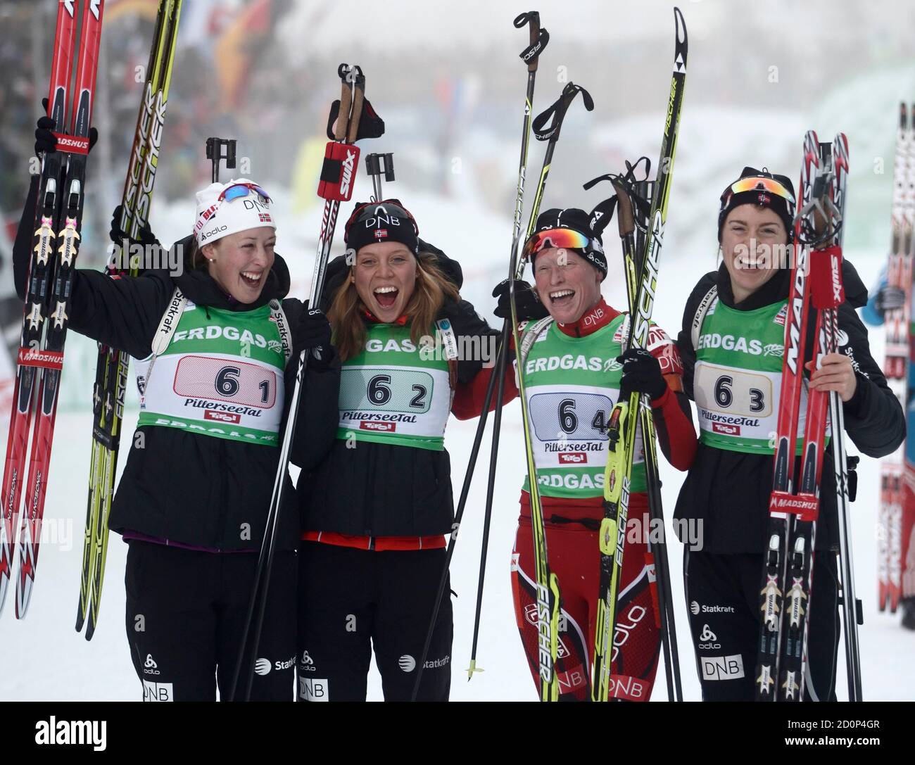 Norway's athletes Fanny Welle-Strand Horn, Elise Ringen, Tora Berger and  Synnoeve Solemdal (L-R) pose after the women's 4x6km relay at the Biathlon  World Cup in Hochfilzen, December 11, 2011. REUTERS/Heinz-Peter Bader  (AUSTRIA -
