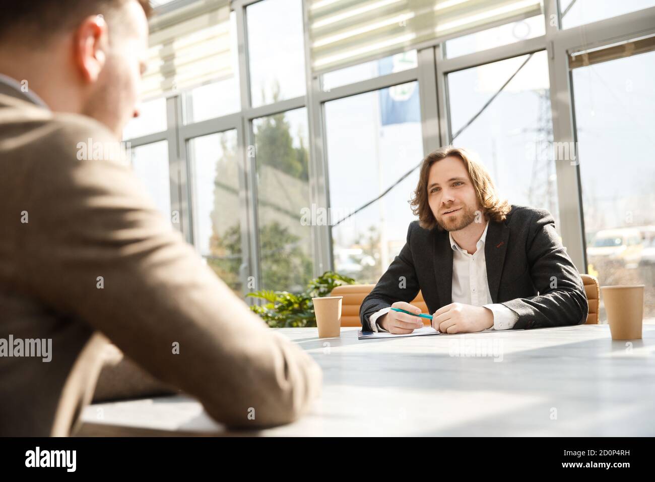 Interviewer is questioning a candidate on a job interview. Stock Photo
