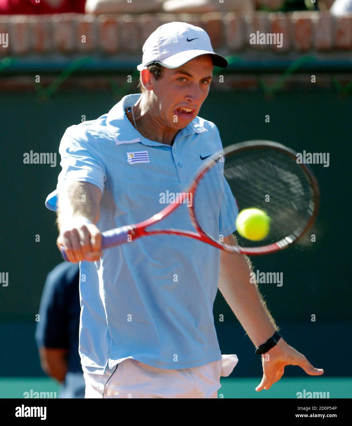 Uruguay's Martin Cuevas hits a backhand against Peru's Duilio Beretta  during their Davis Cup tennis match in Montevideo February 10, 2012.  REUTERS/Andres Stapff (URUGUAY - Tags: SPORT TENNIS Stock Photo - Alamy