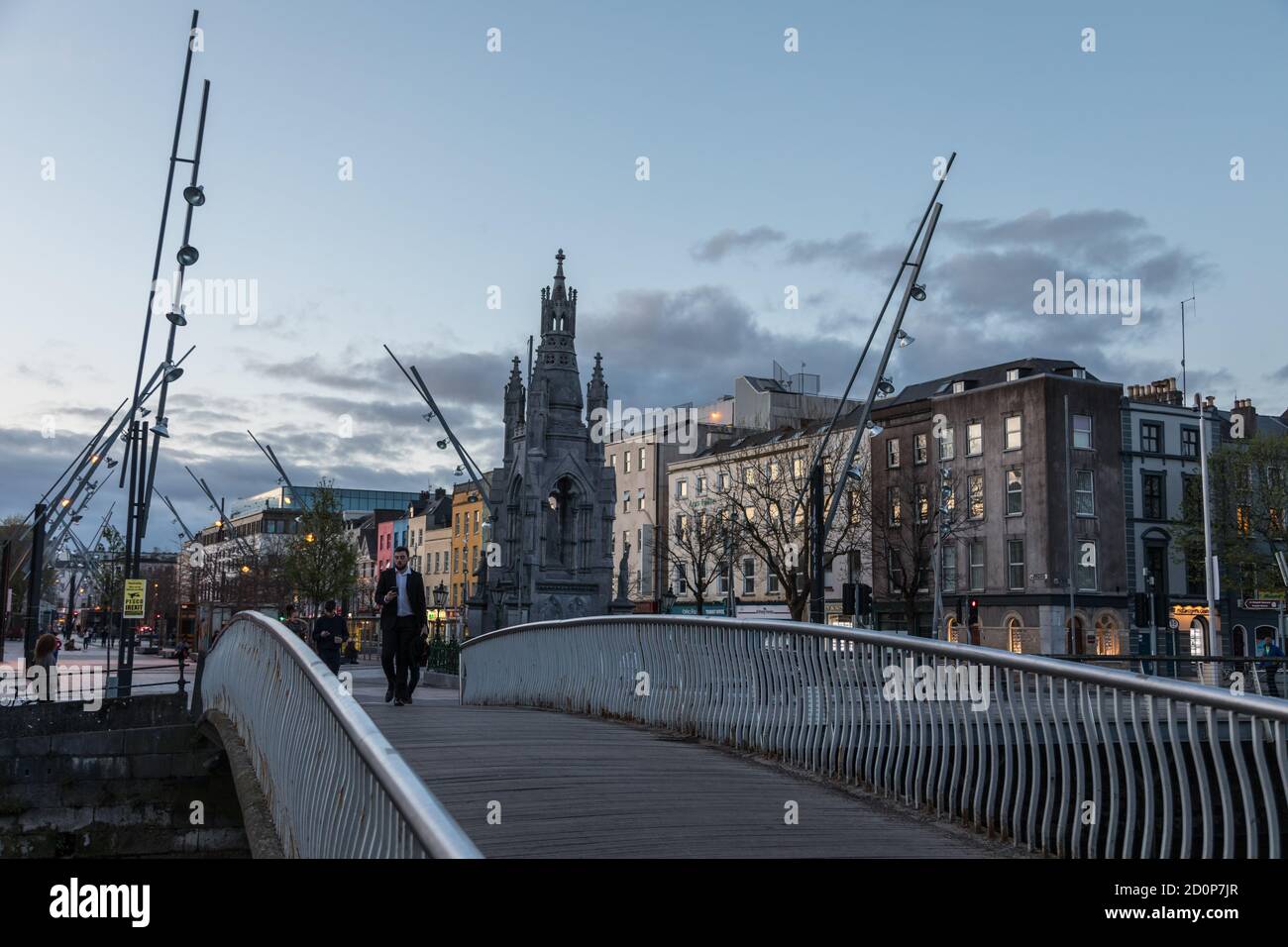 Cork City, Ireland 22nd April, 2018 Man walking across a Foot bridge