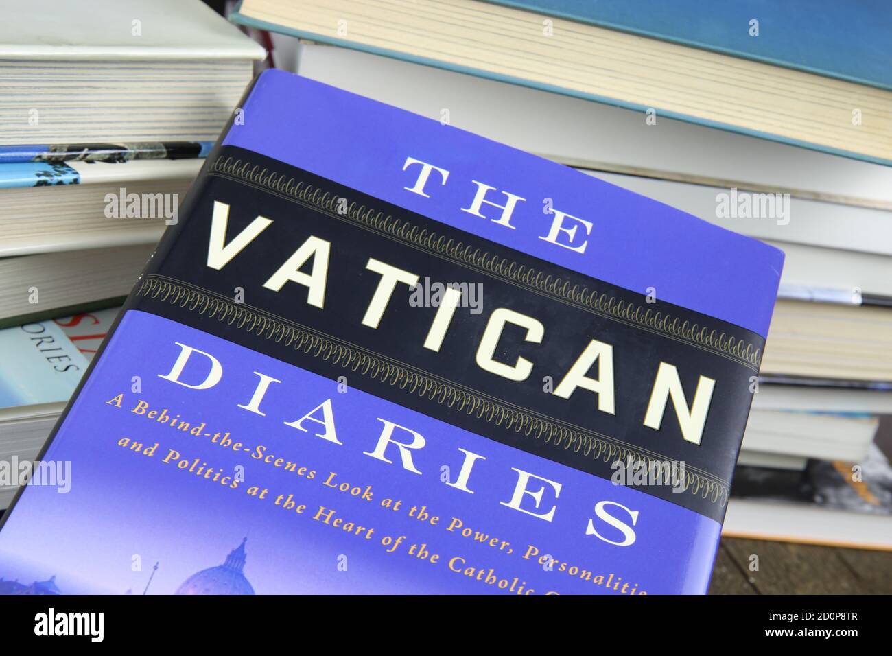 Viersen, Germany - May 9. 2020: View on isolated  book cover the vatican diaries with pile of books background Stock Photo