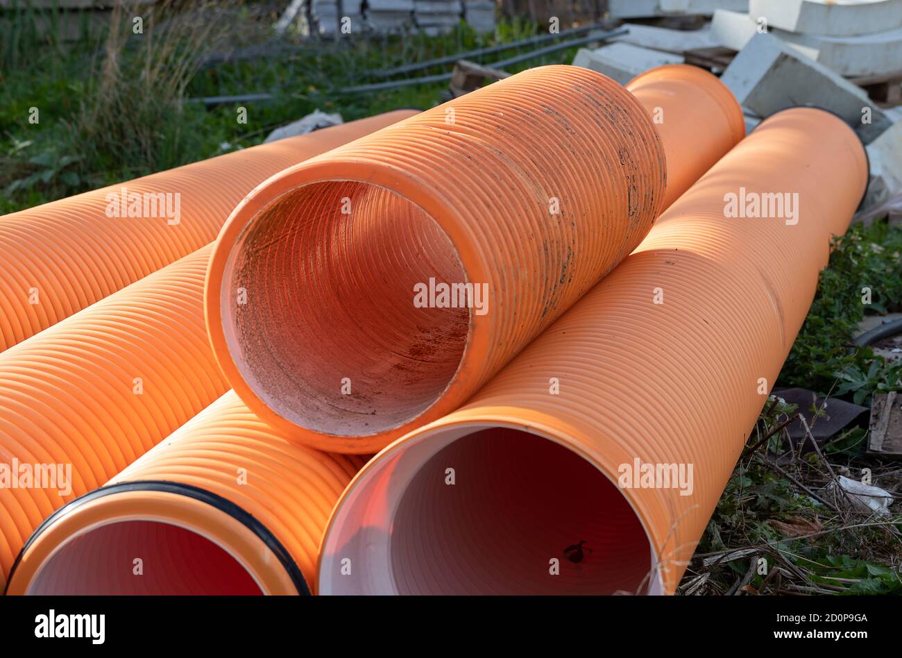 Small construction site. Cement blocks and pipes on the ground, ready