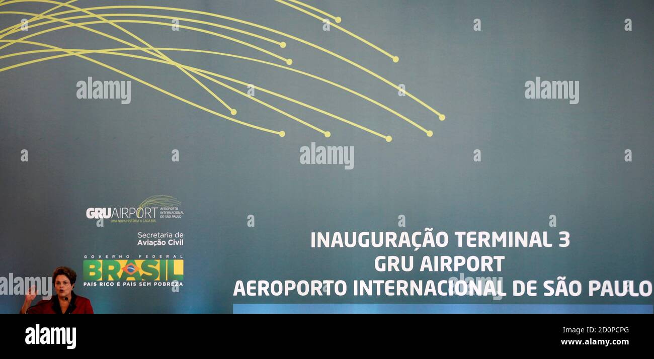 Brazilian President Dilma Rousseff speaks as she attends the inauguration of Terminal 3 at Guarulhos International airport in Sao Paulo May 20, 2014. The new terminal includes 20 departure gates, a runway with a capacity for 34 aircraft, and is expected to receive 12 million passengers each year. REUTERS/Paulo Whitaker (BRAZIL - Tags: SPORT SOCCER WORLD CUP TRANSPORT POLITICS) Stock Photo