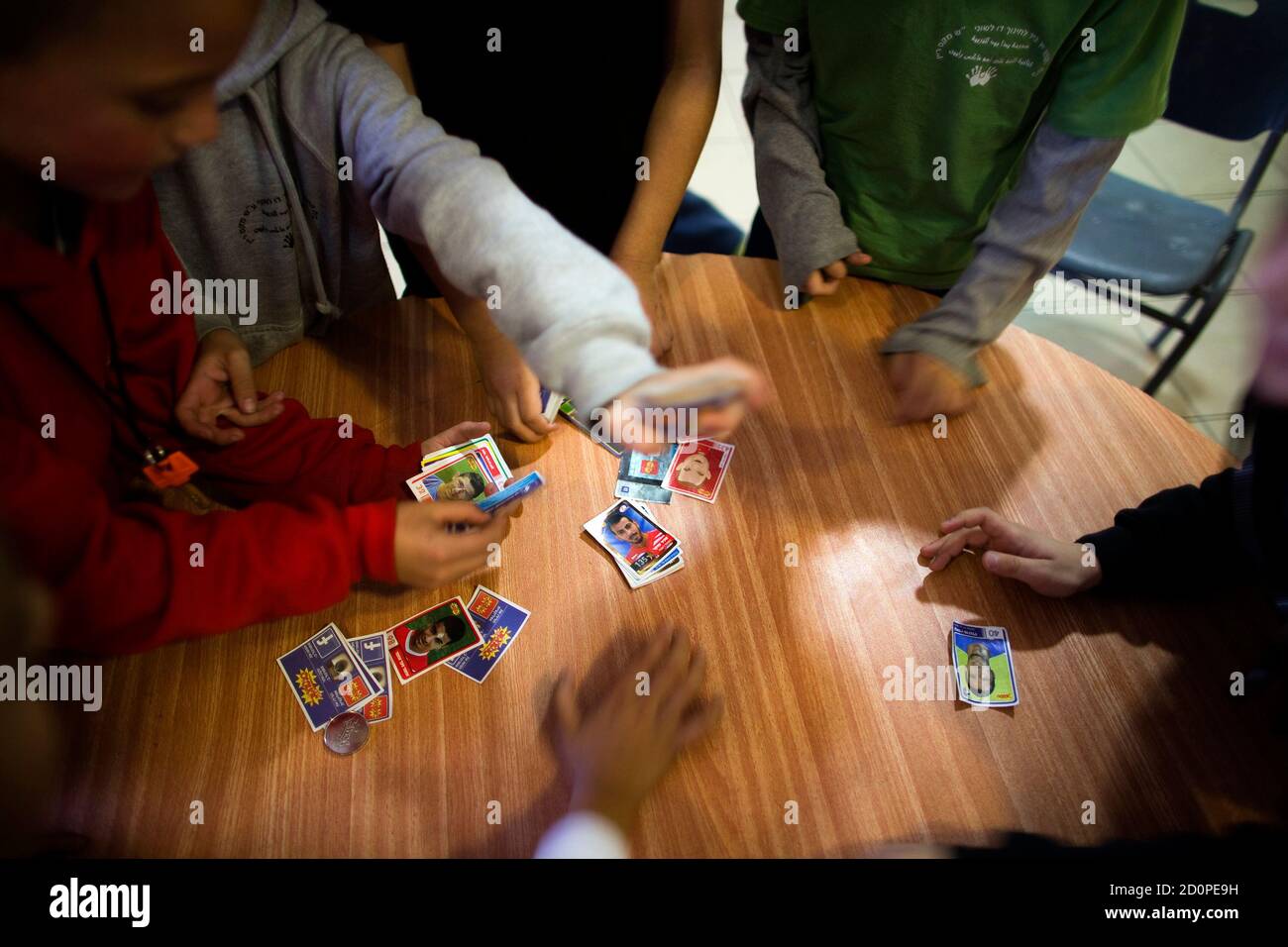 Second grade school children play during lunch break at the Hand in Hand  Arab Jewish bilingual school in Jerusalem December 3, 2014. The Hand in  Hand school in Jerusalem presents an almost