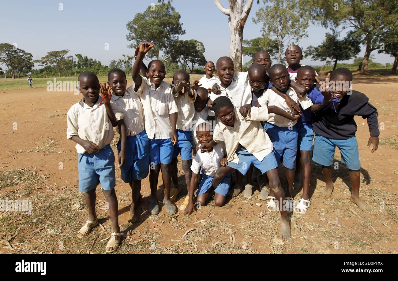 Pupils pose for a photograph during breaktime at the Senator Obama primary school in the U.S. President Barack Obama's ancestral village of Nyang'oma Kogelo, west of Kenya's capital Nairobi, July 16, 2015. Obama visits Kenya and Ethiopia in July, his third major trip to Sub-Saharan Africa after travelling to Ghana in 2009 and to Tanzania, Senegal and South Africa in 2011. He has also visited Egypt, in North Africa, and South Africa for Nelson Mandela's funeral. Obama will be welcomed by a continent that had expected closer attention from a man they claim as their son, a sentiment felt acutely  Stock Photo