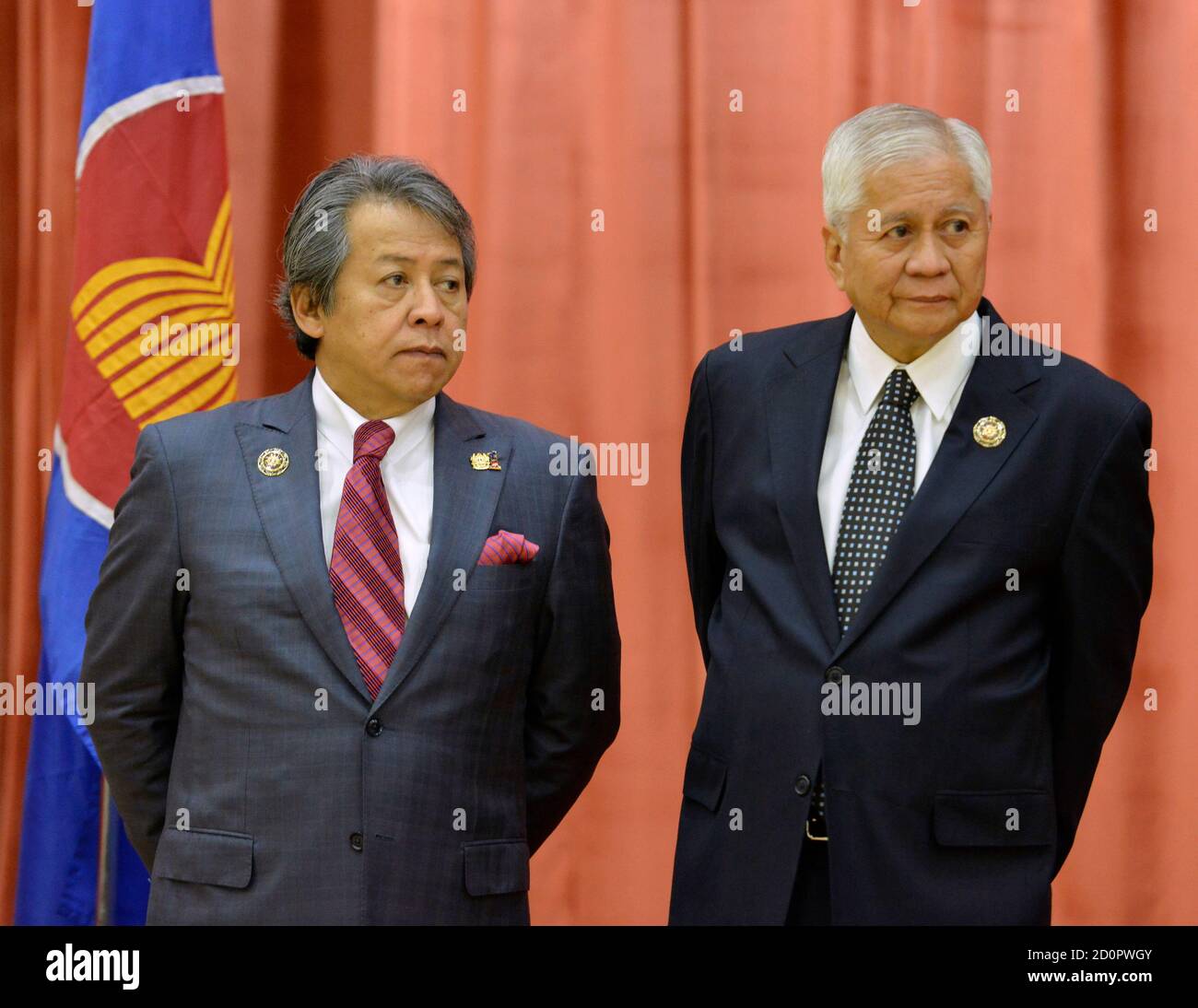 Philippines Secretary Of Foreign Affairs Albert Del Rosario R And His Malaysian Counterpart Anifah Aman Wait During A Group Photo Session Before The 14th Association Of Southeast Asian Nations Asean Plus Three
