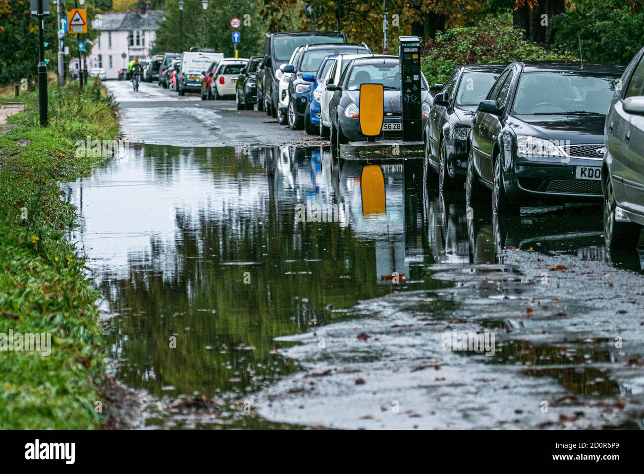 WIMBLEDON LONDON,UK 3 October 2020. Cars parked on a flooded  road in Wimbledon following heavy overnight rain brought about by Storm Alex coming from France causing flooding and damage to many parts in Southern England.  Credit: amer ghazzal/Alamy Live News Stock Photo