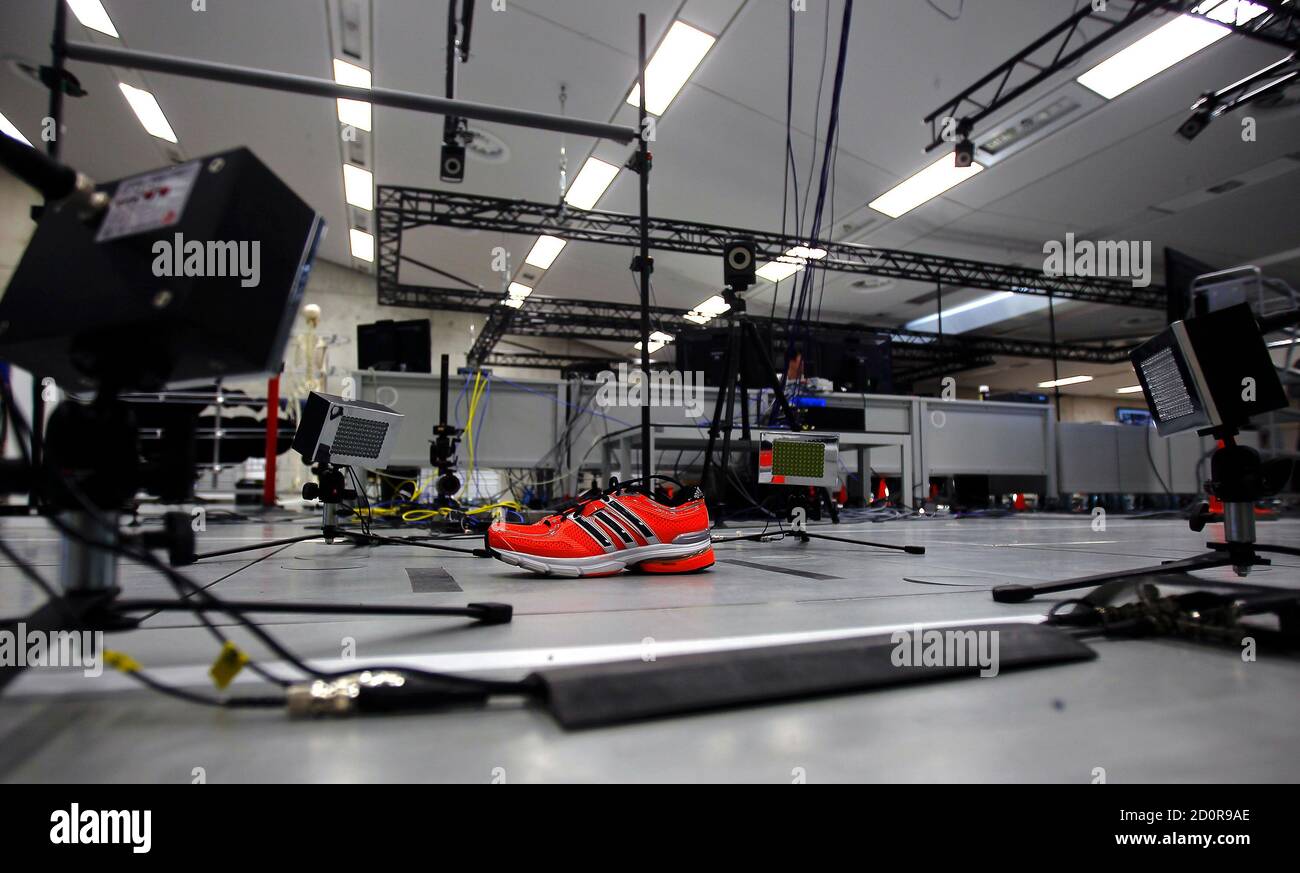 An Adidas running is placed on a surface with high speed cameras for at the Adidas innovation laboratory in Herzogenaurach May 7, 2012. U.S. market Nike and German rival