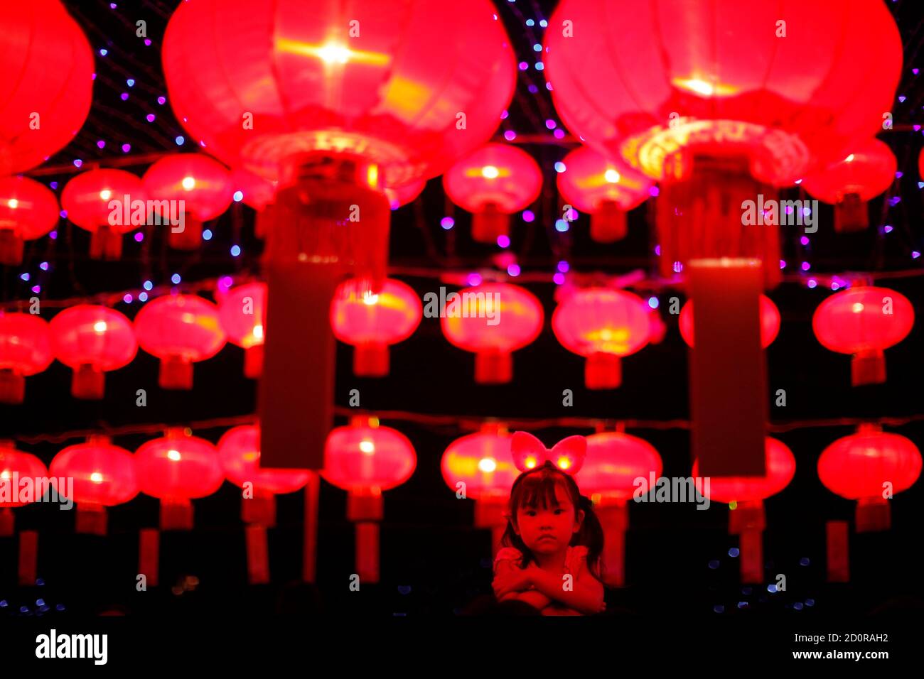 A Girl Looks At Lanterns As She Visits The Shanghai International Lantern Festival In Luxun Park At Hongkou District In Shanghai September 12 2012 According To Chinese Tradition People Try To Solve