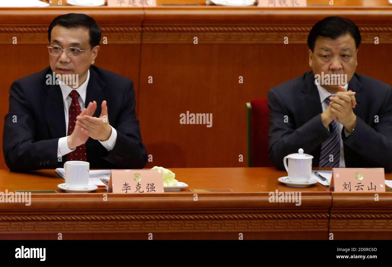 China's Politburo Standing Committee member Liu Yunshan (R ) and China's Vice Premier Li Keqiang attend the opening ceremony of the Chinese People's Political Consultative Conference (CPPCC) at the Great Hall of the People in Beijing March 3, 2013. A reformist member of China's decision-making Politburo, Li Yuanchao, is set to become the country's vice president this week instead of a more senior and conservative official best known for keeping the media in check, sources said. Li Yuanchao's appointment would be a sign that new Communist Party leader and incoming president Xi Jinping's clout i Stock Photo