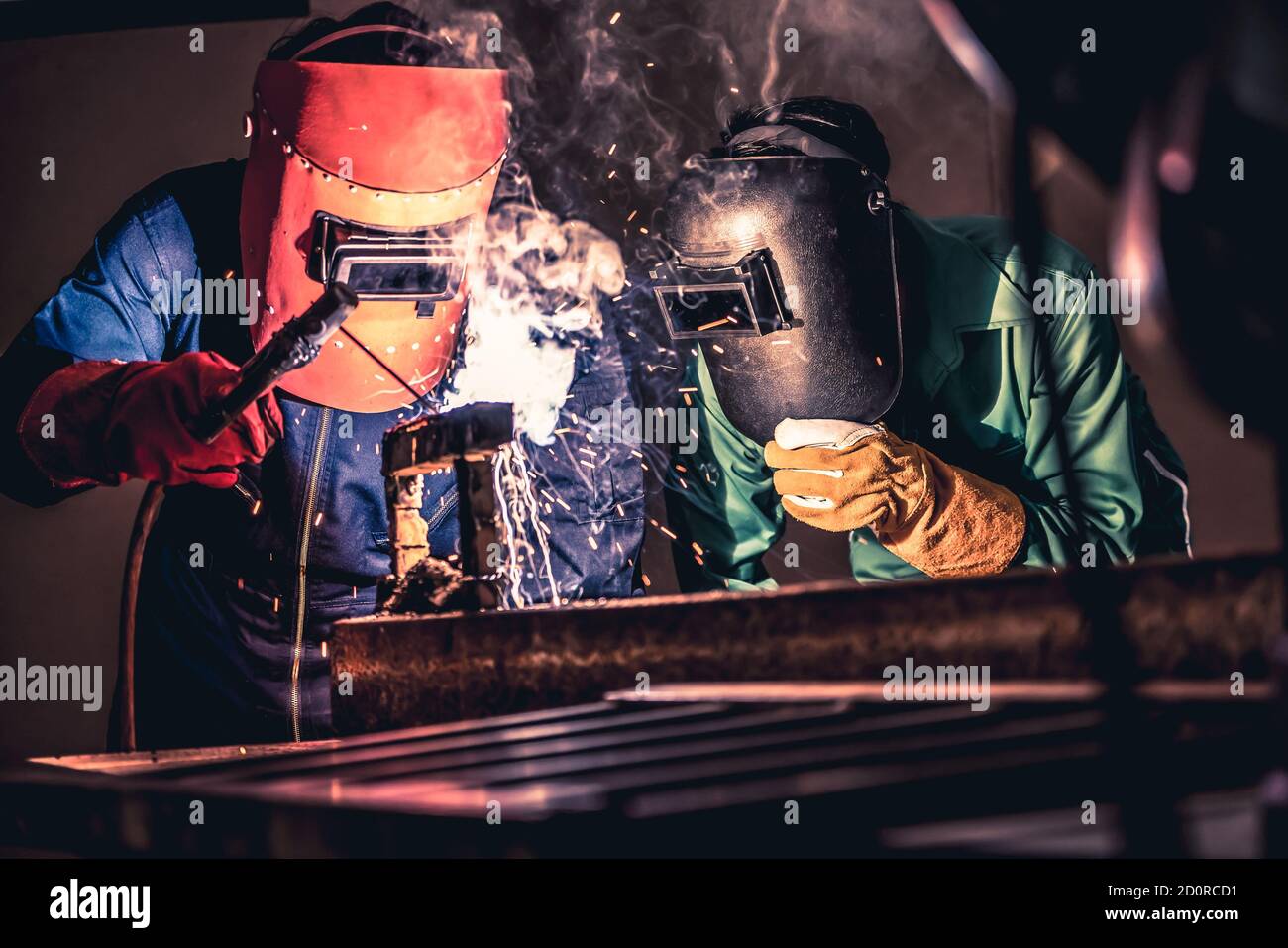 Metal welding steel works using electric arc welding machine to weld