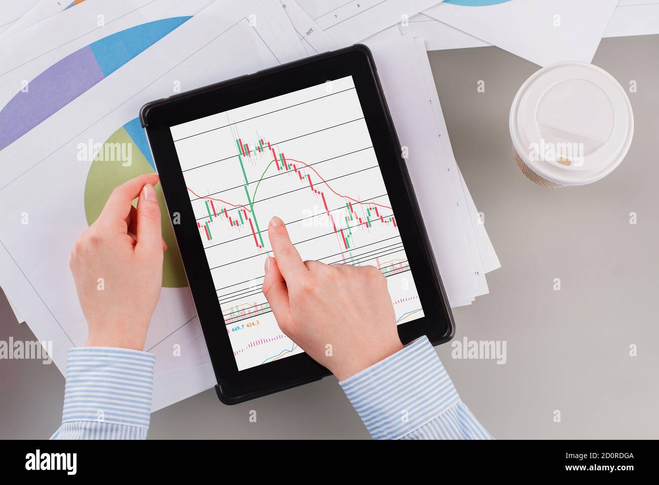 Close up female hands holding digital tablet with graphs Stock Photo ...