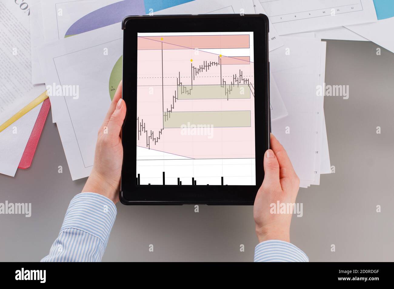 Woman using financial application on digital tablet. Stock Photo