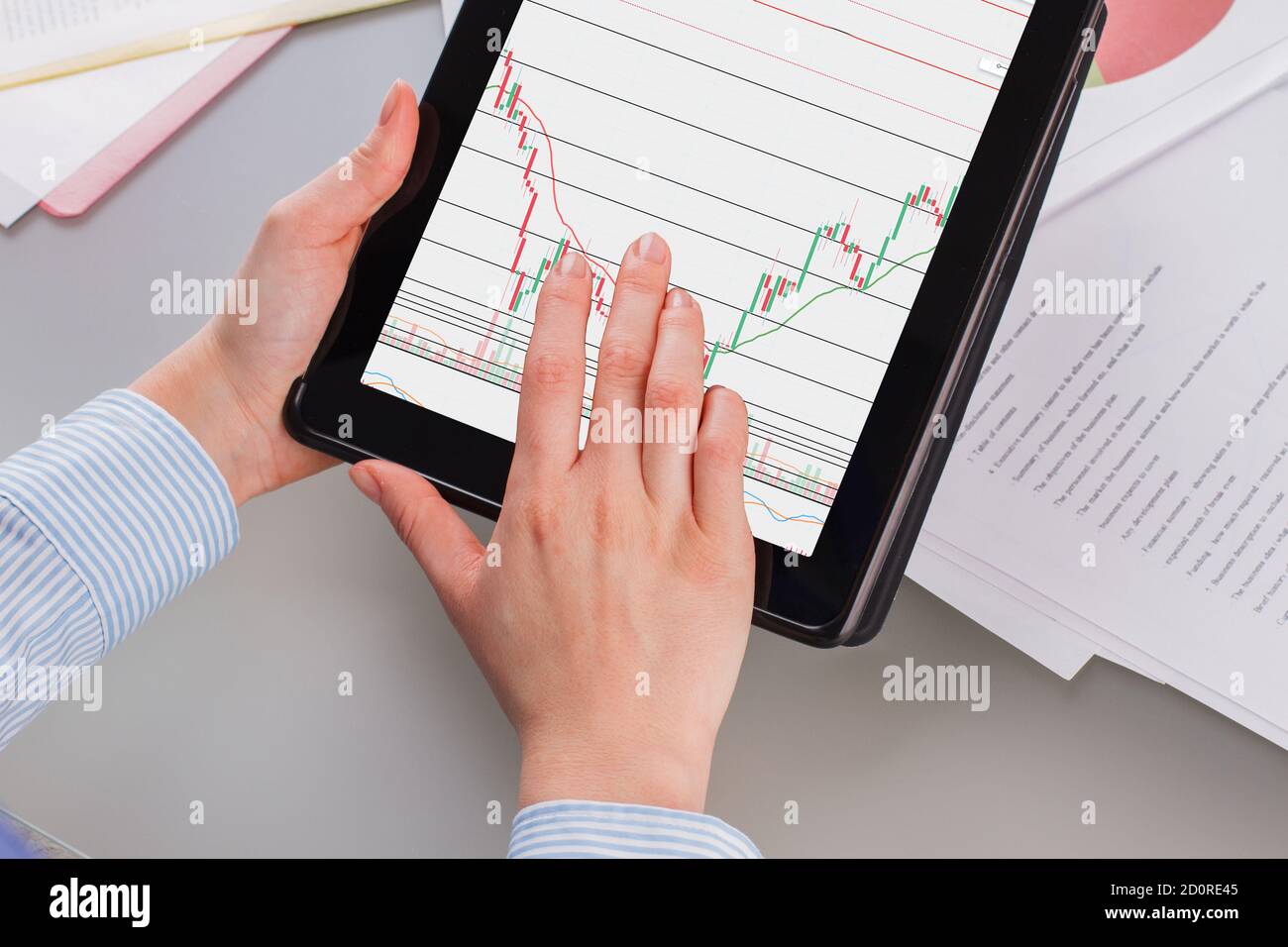 Hands holding tablet with digital marketing. Stock Photo