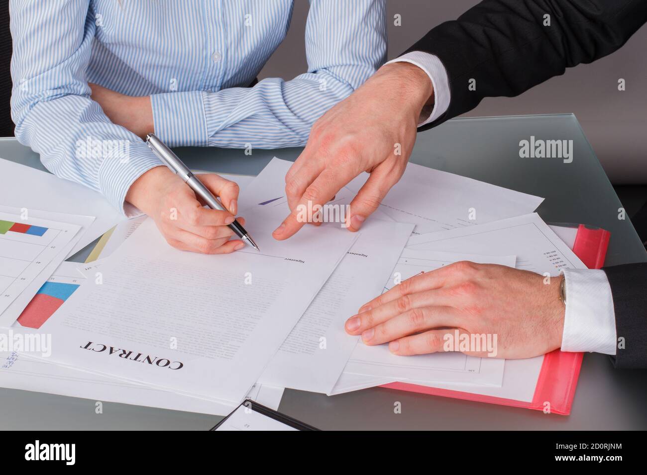 Businessman signing documents sitting table hi-res stock photography ...