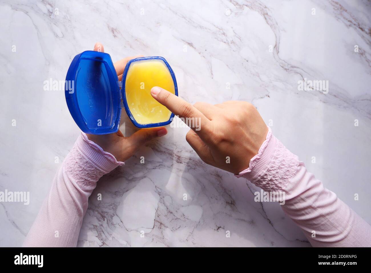 top view of women hand using petroleum jelly  Stock Photo