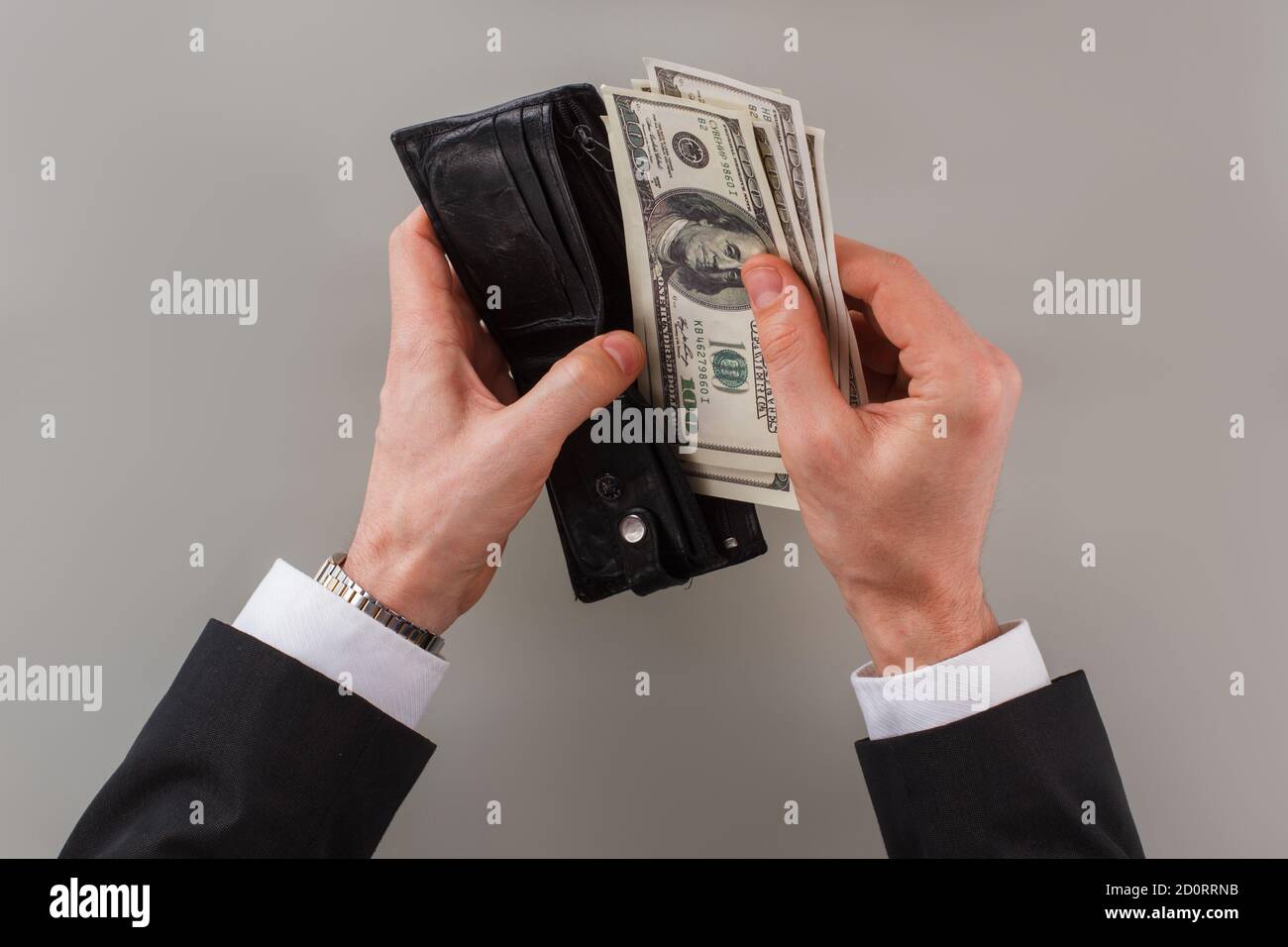 Business person hand puts money hi-res stock photography and images - Alamy