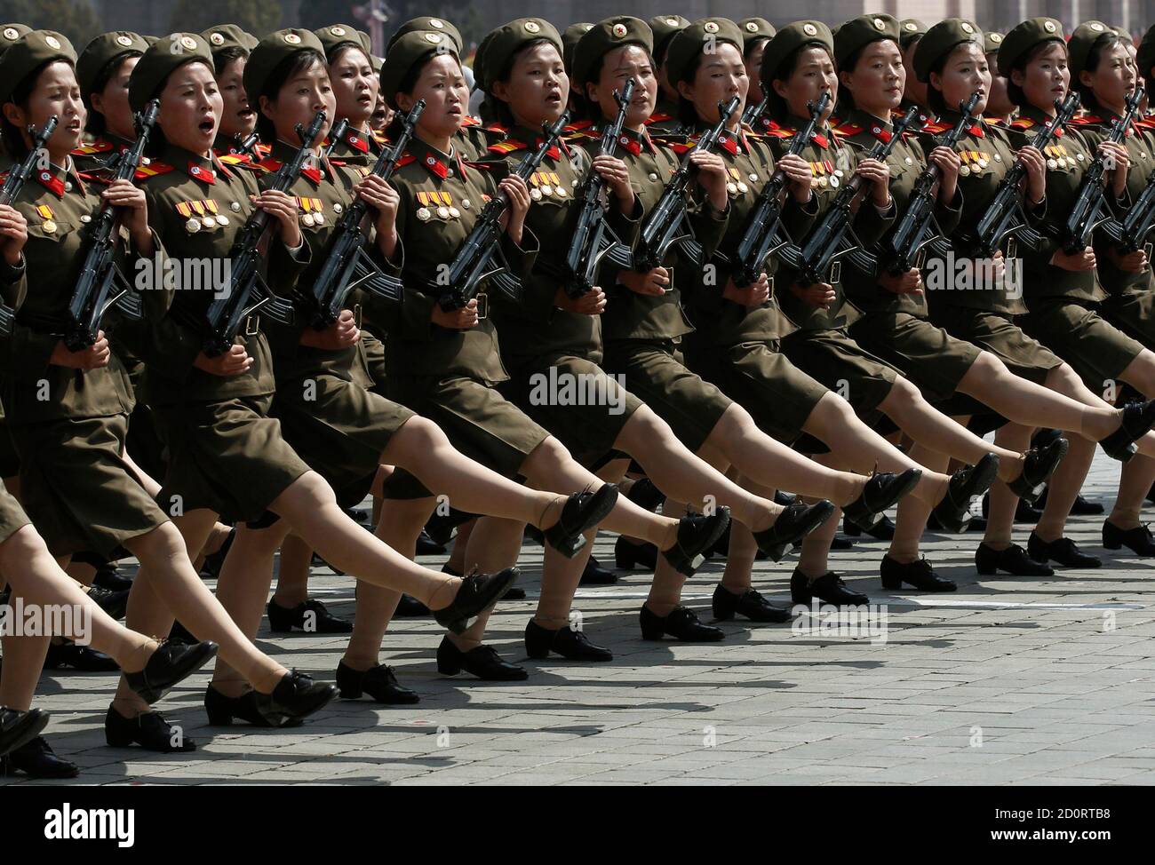 Soldiers shout as they march past the podium during a military parade to celebrate the centenary of the birth of North Korea founder Kim Il-sung in Pyongyang April 15, 2012. REUTERS/Bobby Yip (NORTH KOREA - Tags: POLITICS MILITARY ANNIVERSARY) Stock Photo