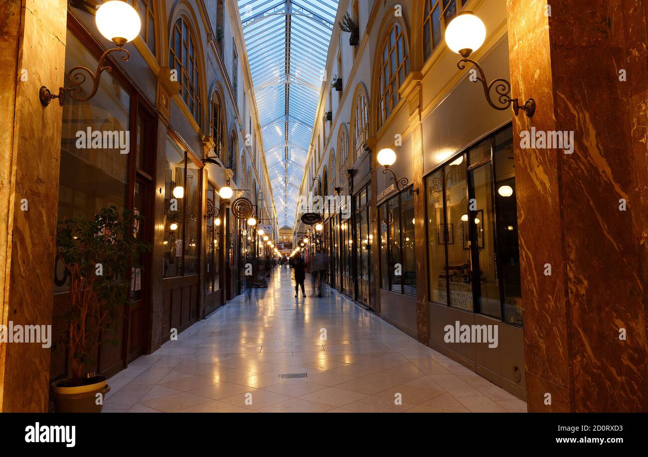 Interior of Passage Choiseul ,designed by Francois Mazois, 1827 - shopping area with clothing stores, book stores, jewelers shops and art galleries. Stock Photo