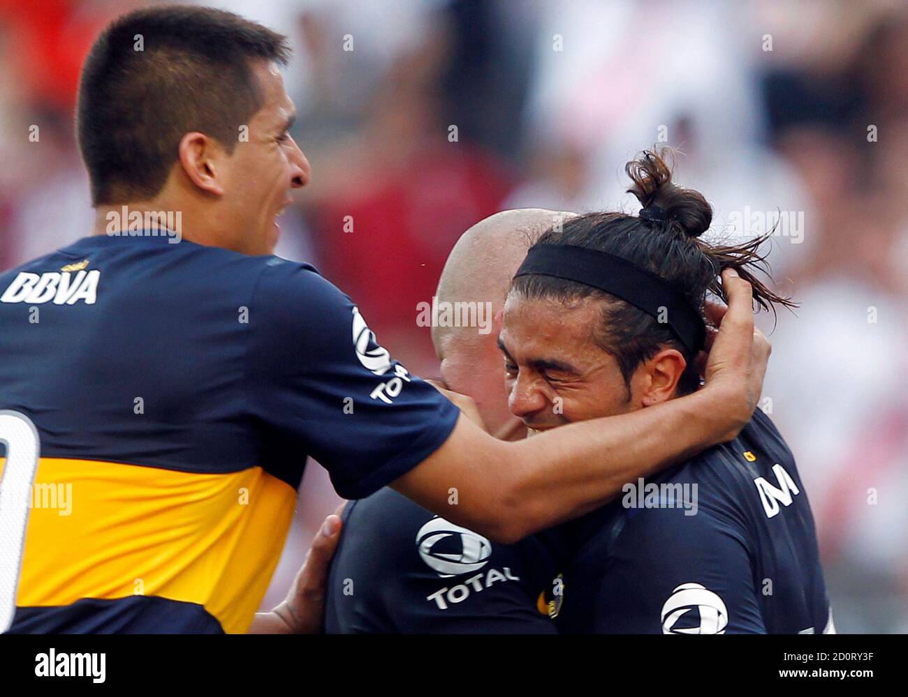 Boca Juniors Walter Erviti R Is Embraced By Teammates Santiago Silva C And Lucas Viatri After He Scored His Team S Second Goal To Tie Their Argentine First Division Soccer Match Against River