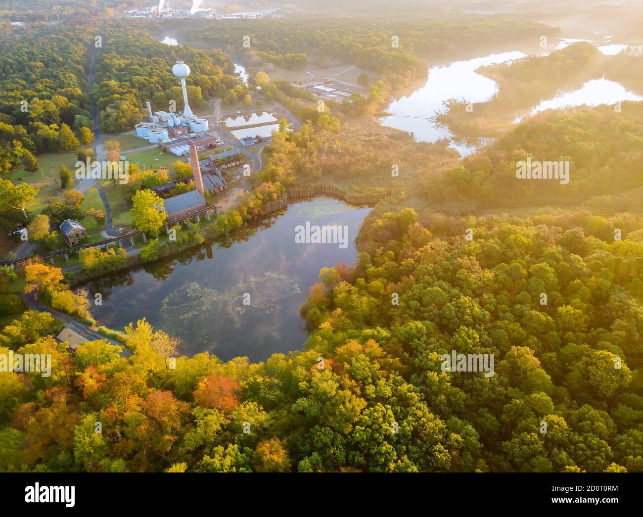 Forest in the autumn from a height a beautiful panorama of beautiful calm lake at sunrise, morning landscape Stock Photo