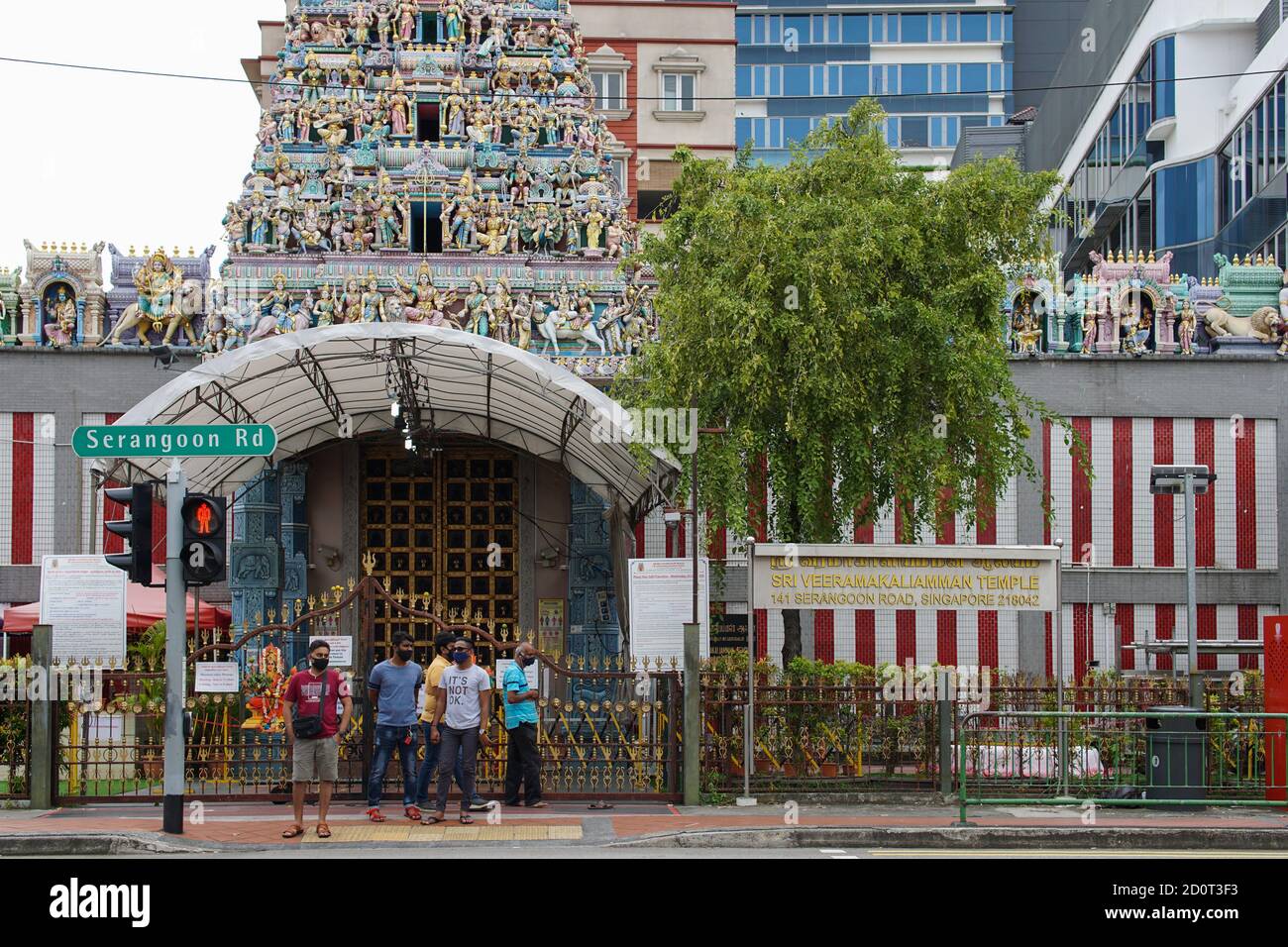 Red light crossing outside a temple in Little India, Singapore Stock Photo