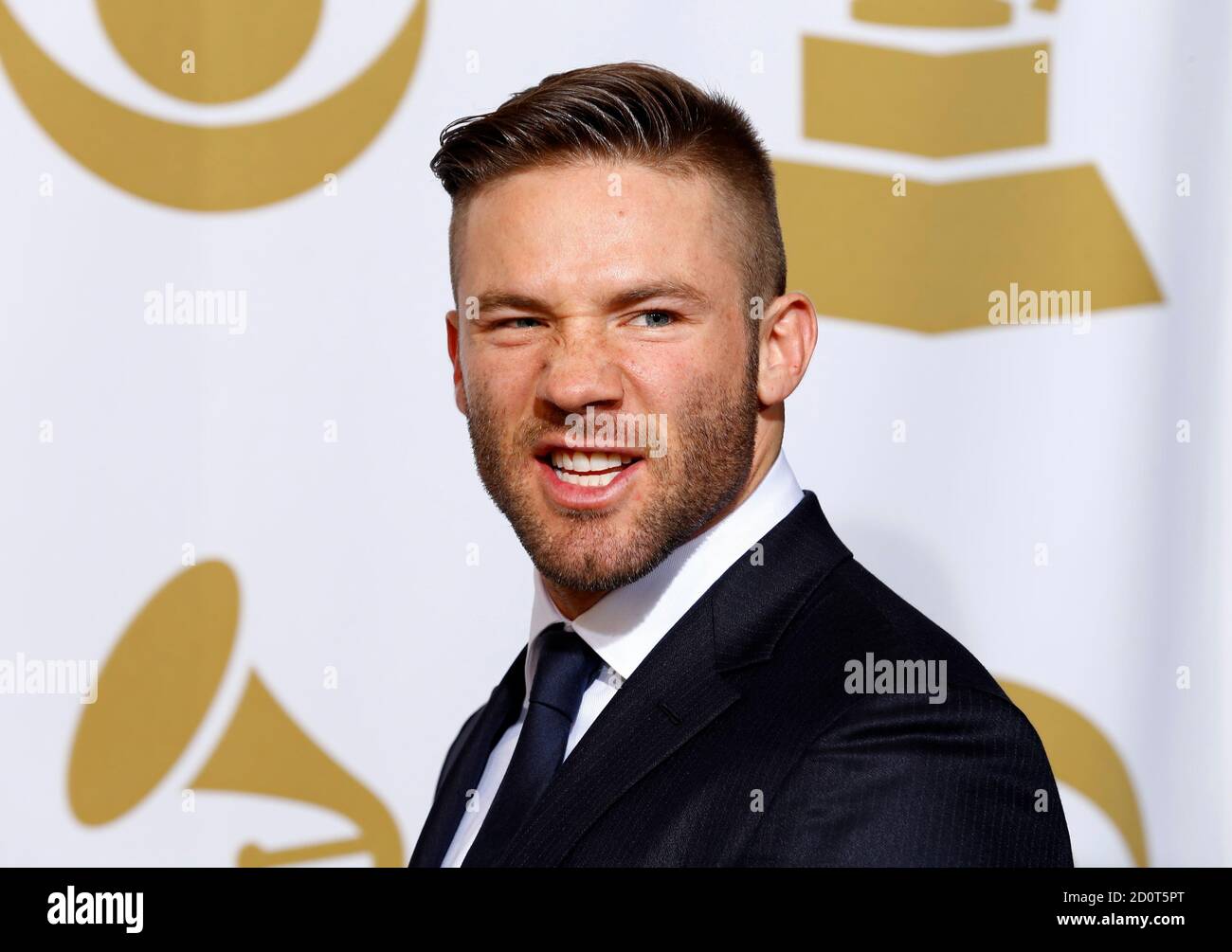 Presenter Julian Edelman, of the New England Patriots, poses in the press  room during the 57th annual Grammy Awards in Los Angeles, California  February 8, 2015. REUTERS/Mike Blake (UNITED STATES - Tags:
