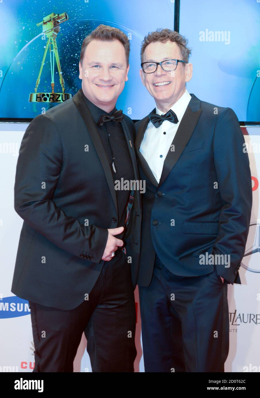 German fashion designer Guido Maria Kretschmer (L) and his husband Frank Mutters pose on the red carpet for the 'Die Goldene Kamera' (Golden Camera) awards ceremony in Hamburg, February 27, 2015. The Golden Cameras are awarded by a popular German TV magazine honouring excellence in the areas of television, film and entertainment.    REUTERS/Fabian Bimmer (GERMANY  - Tags: ENTERTAINMENT) Stock Photo