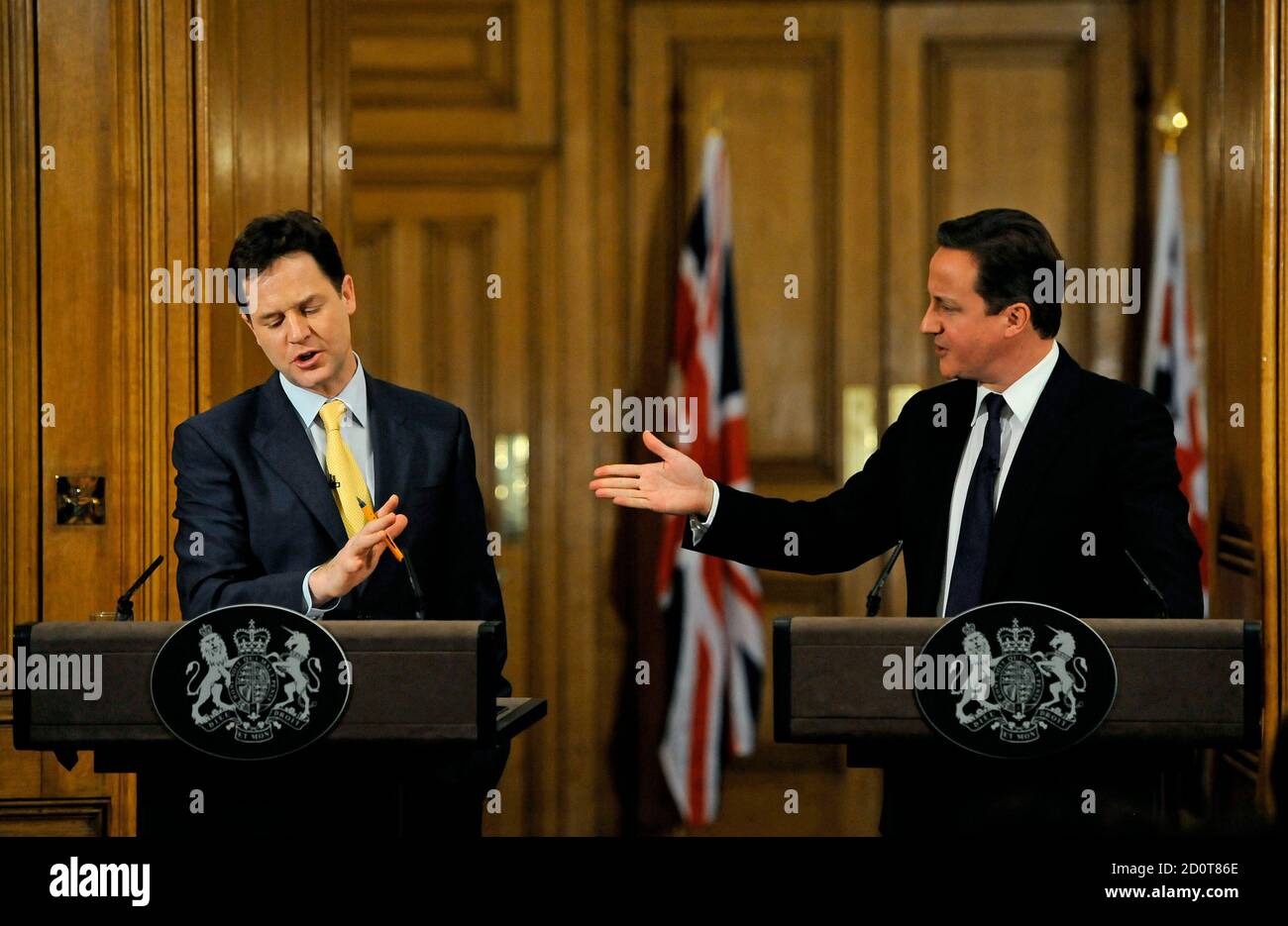Britain's Prime Minister David Cameron (R) gestures to Deputy Prime Minister Nick Clegg during their joint news conference at number 10 Downing Street in London December 21, 2010. REUTERS/Carl De Souza/Pool (BRITAIN - Tags: POLITICS) Stock Photo