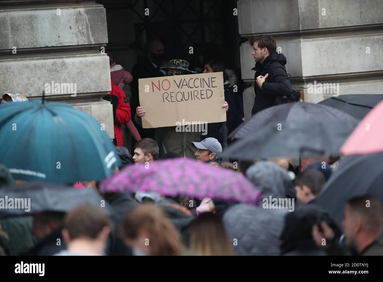A protester holds a sign at an anti-lockdown protest in Old Market Square, Nottingham, after a range of new restrictions to combat the rise in coronavirus cases came into place in England. Stock Photo