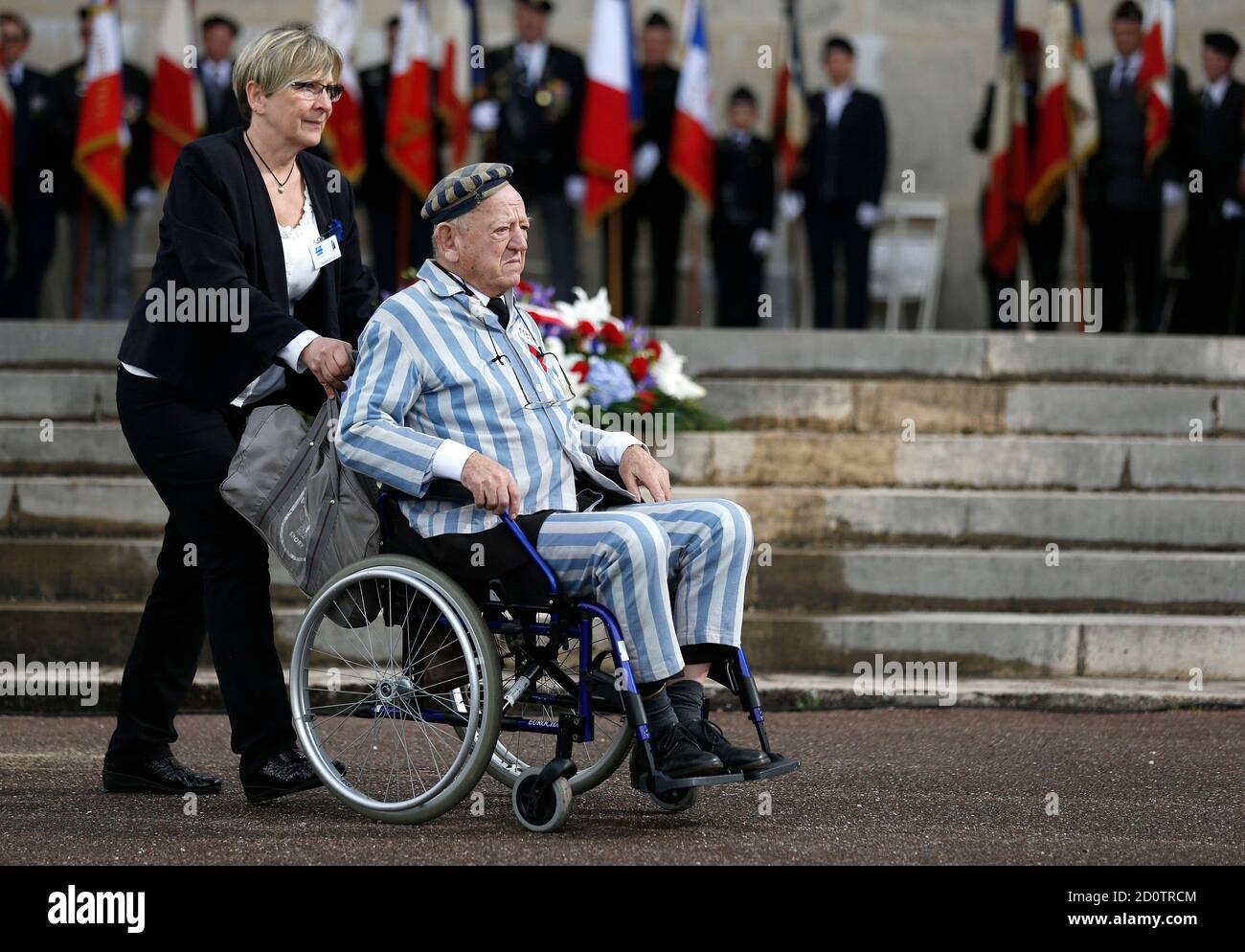 Holocaust survivor Robert Salomon is pushed in a wheelchair at the former  World War II concentration camp of Natzweiler-Struthof during ceremonies to  mark the French National Deportation Day, in Natzweiler, eastern France,