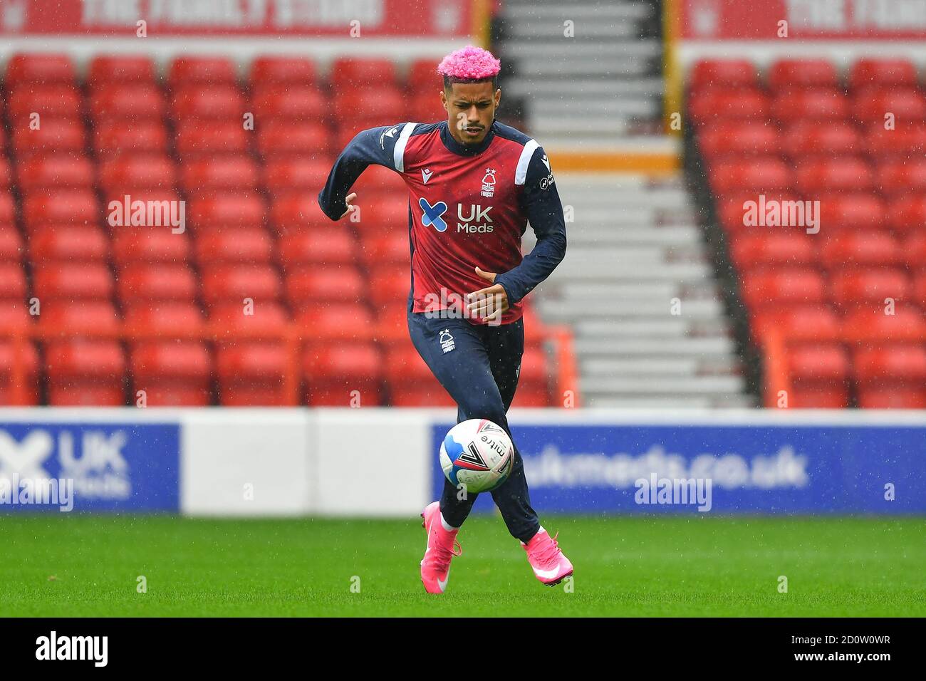 NOTTINGHAM, ENGLAND. OCTOBER 3RD Lyle Taylor of Nottingham Forest raising awareness with pink hair and boots for Cancer Research UK during the Sky Bet Championship match between Nottingham Forest and Bristol City at the City Ground, Nottingham on Saturday 3rd October 2020. (Credit: Jon Hobley | MI News) Credit: MI News & Sport /Alamy Live News Stock Photo