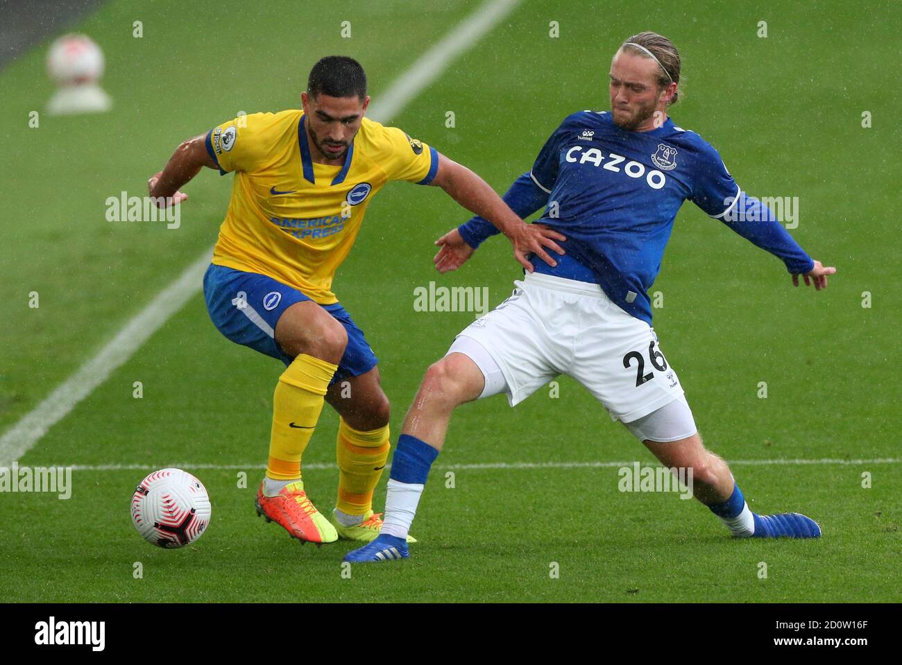 Brighton and Hove Albion's Neal Maupay and Everton's Tom Davies (right) battle for the ball during the Premier League match at Goodison Park, Liverpool. Stock Photo