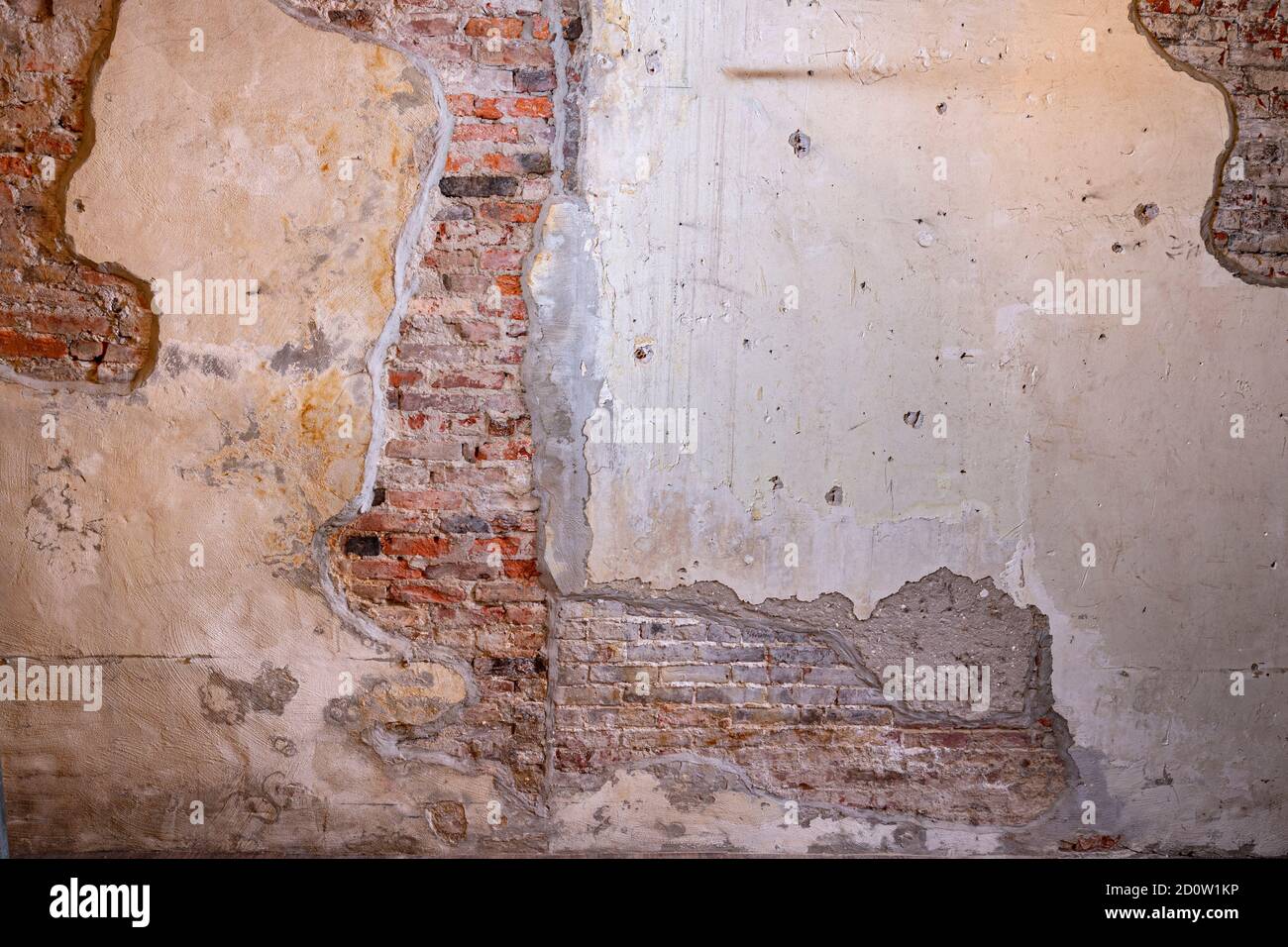 Exposed brick, crumbling plaster on decaying wall, Philadelphia, USA Stock Photo