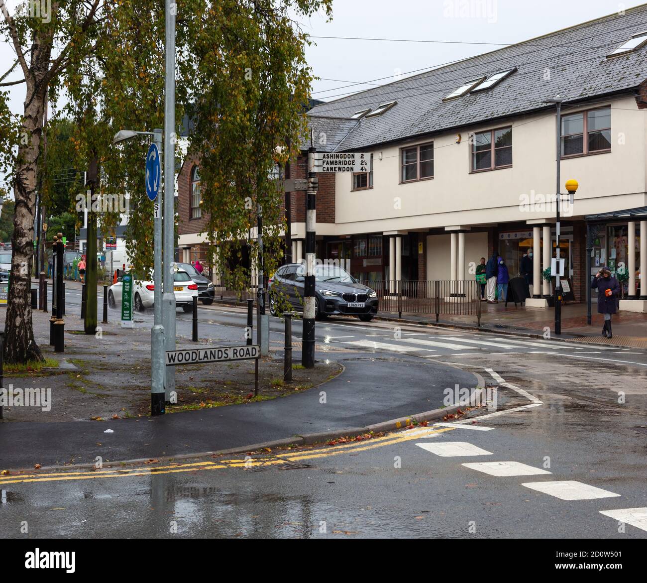 Street view of shoppers along high street on a wet day, Hockley, Essex, UK Stock Photo Alamy