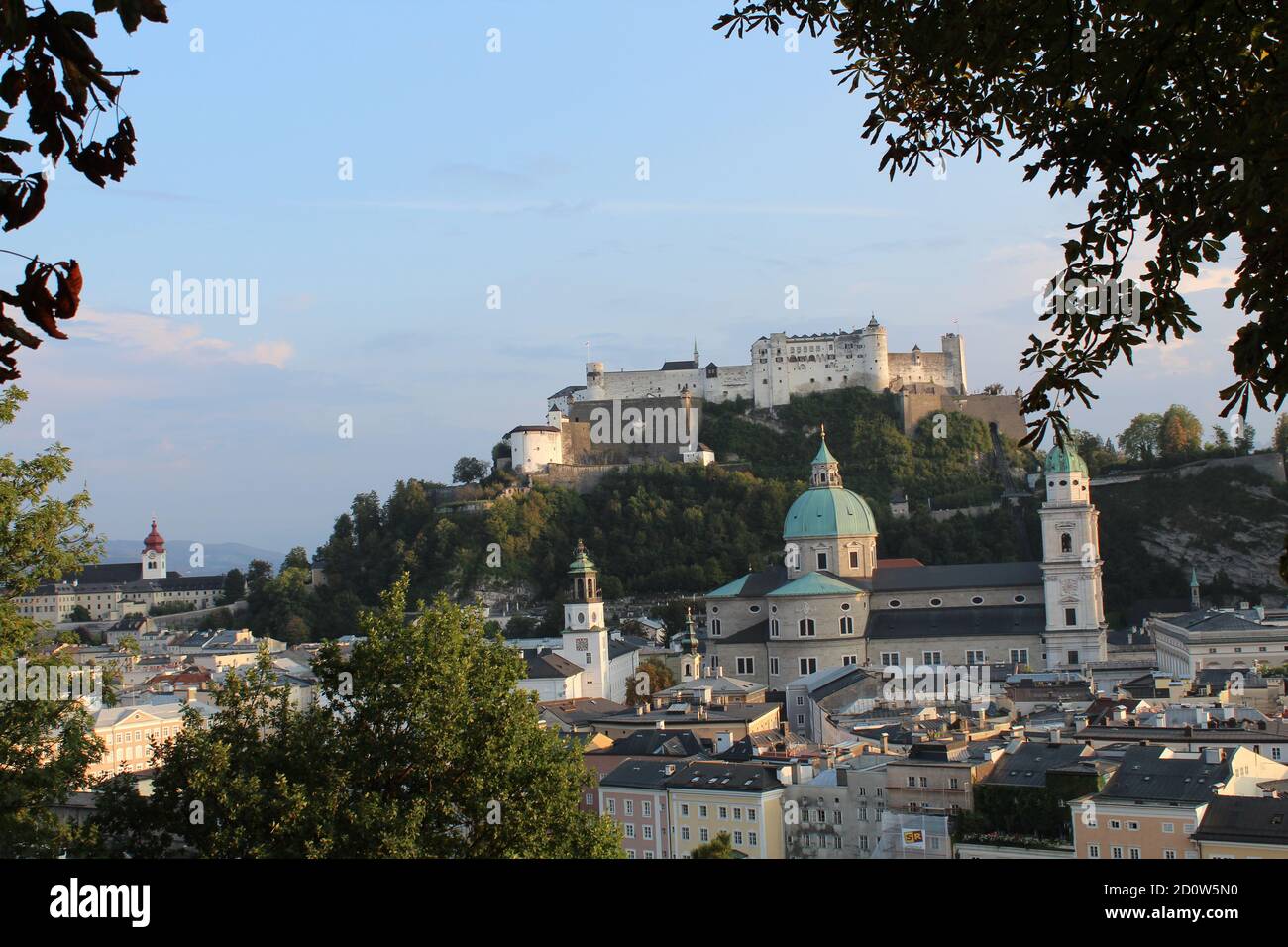 View on the Festung Hohensalzburg through trees, Salzburg, Austria Stock Photo