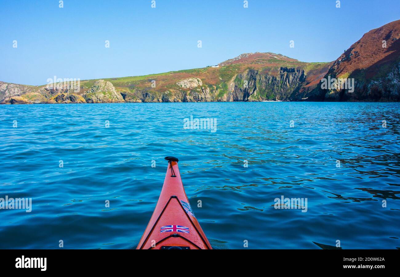 sea kayaking off Pwll Deri, Strumbles Head on the Pembrokeshire Coast, Wales Stock Photo