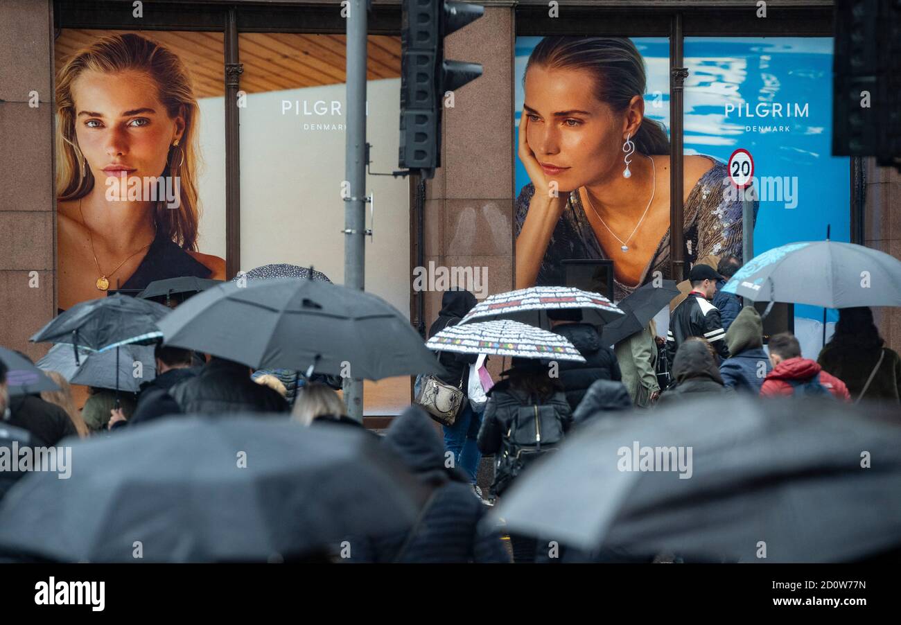 Edinburgh, Scotland, UK. 3 October, 2020. An amber rainfall warning for the east of Scotland did not deter many shoppers from walking along Princes Street in Edinburgh today. Persistent heavy rain fell throughout the morning and afternoon. Iain Masterton/Alamy Live News Stock Photo