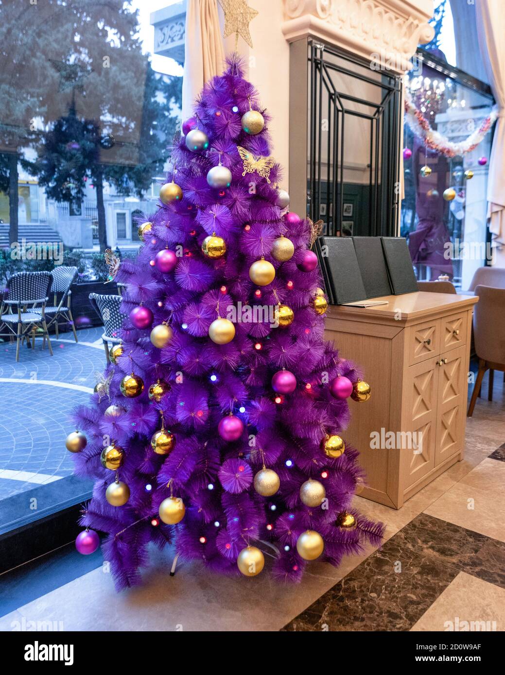 Purple Christmas tree in the restaurant Stock Photo